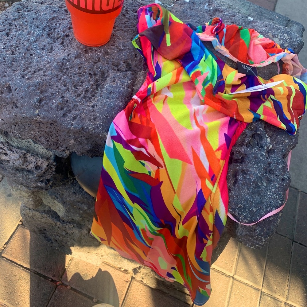 Colorful tight fitting dress with open sides and back
